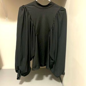 Formal black blouse with bishop style long sleeves